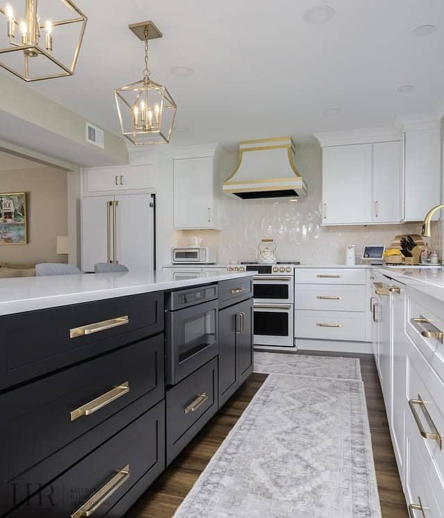 20. Elegant Two-Tone Kitchen with Black Base and White Cabinetry with Gold Accents - black and white kitchen ideas