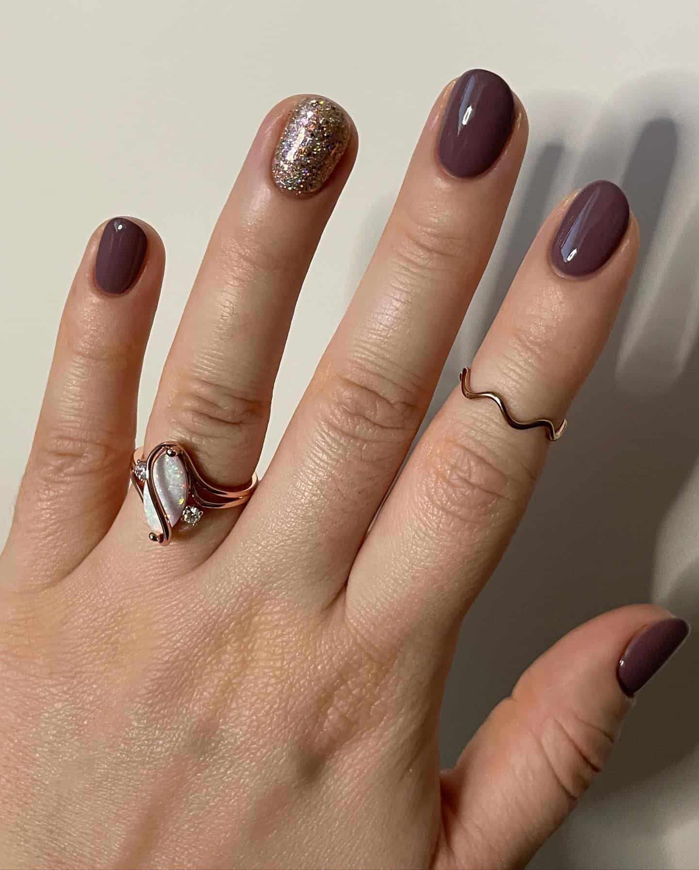 11. Deep Mauve Short Nails with Gold Glitter Accent - taupe nail ideas