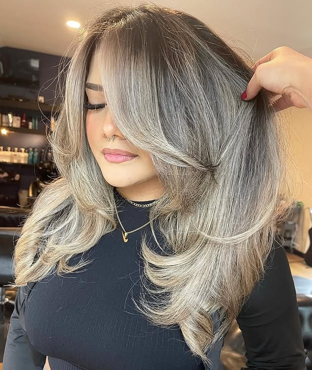 9. Layered Volume Cut with Wispy Ends in Cool Ash Blonde - Wispy Layered Haircuts