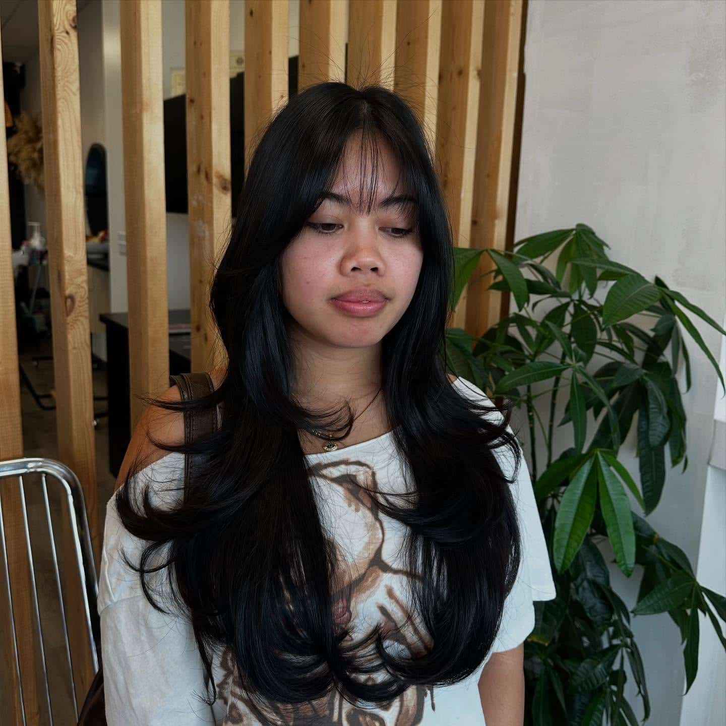 20. Sleek Layered Length with Wispy Ends in Natural Black - Wispy Layered Haircuts