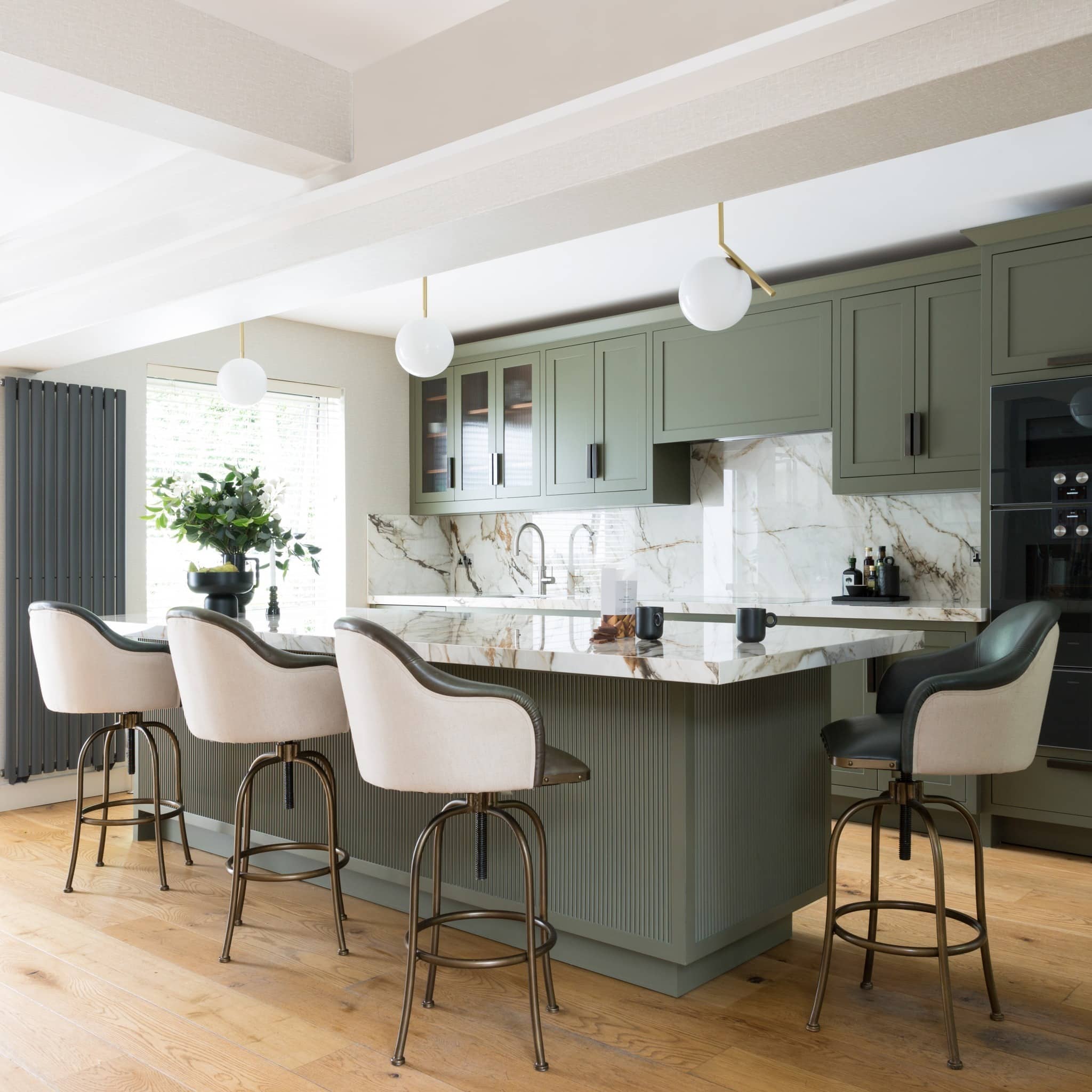 11. Refined Olive Green Kitchen with Waterfall Marble Island - olive green kitchen ideas