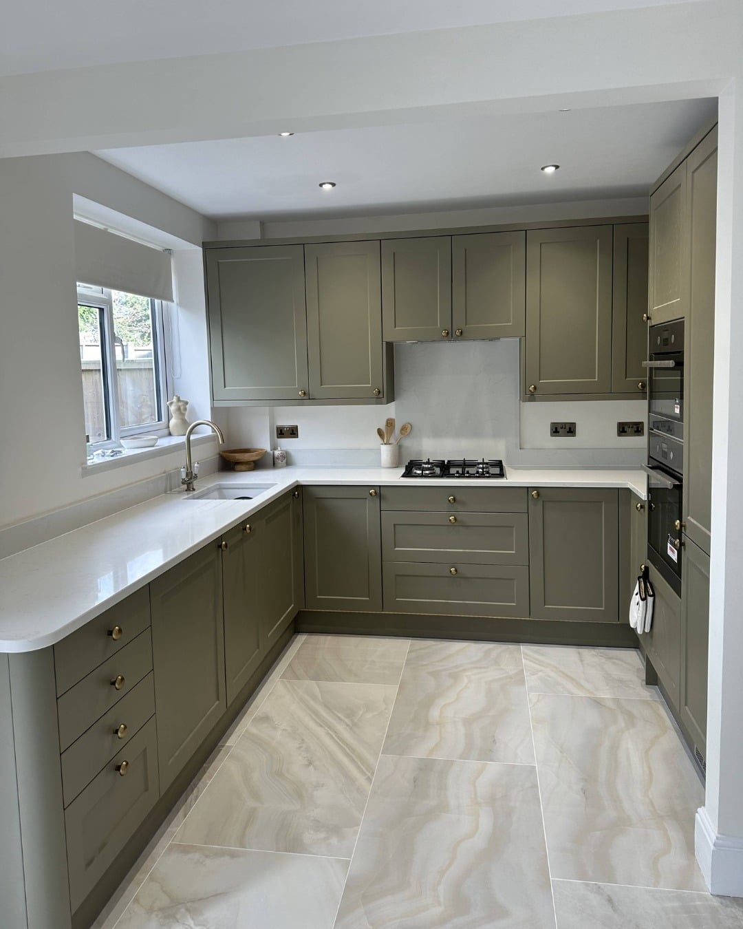 20. Classic Olive Green U-Shaped Kitchen with Marble Flooring - olive green kitchen ideas