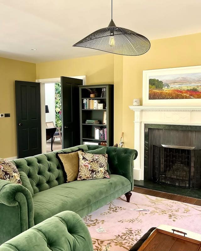 12. Soft Butter Yellow with Deep Green Velvet Contrast - yellow living room ideas