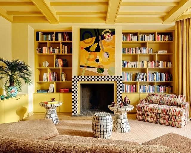 13. Built-In Yellow Shelving with Graphic Art Focus - yellow living room ideas