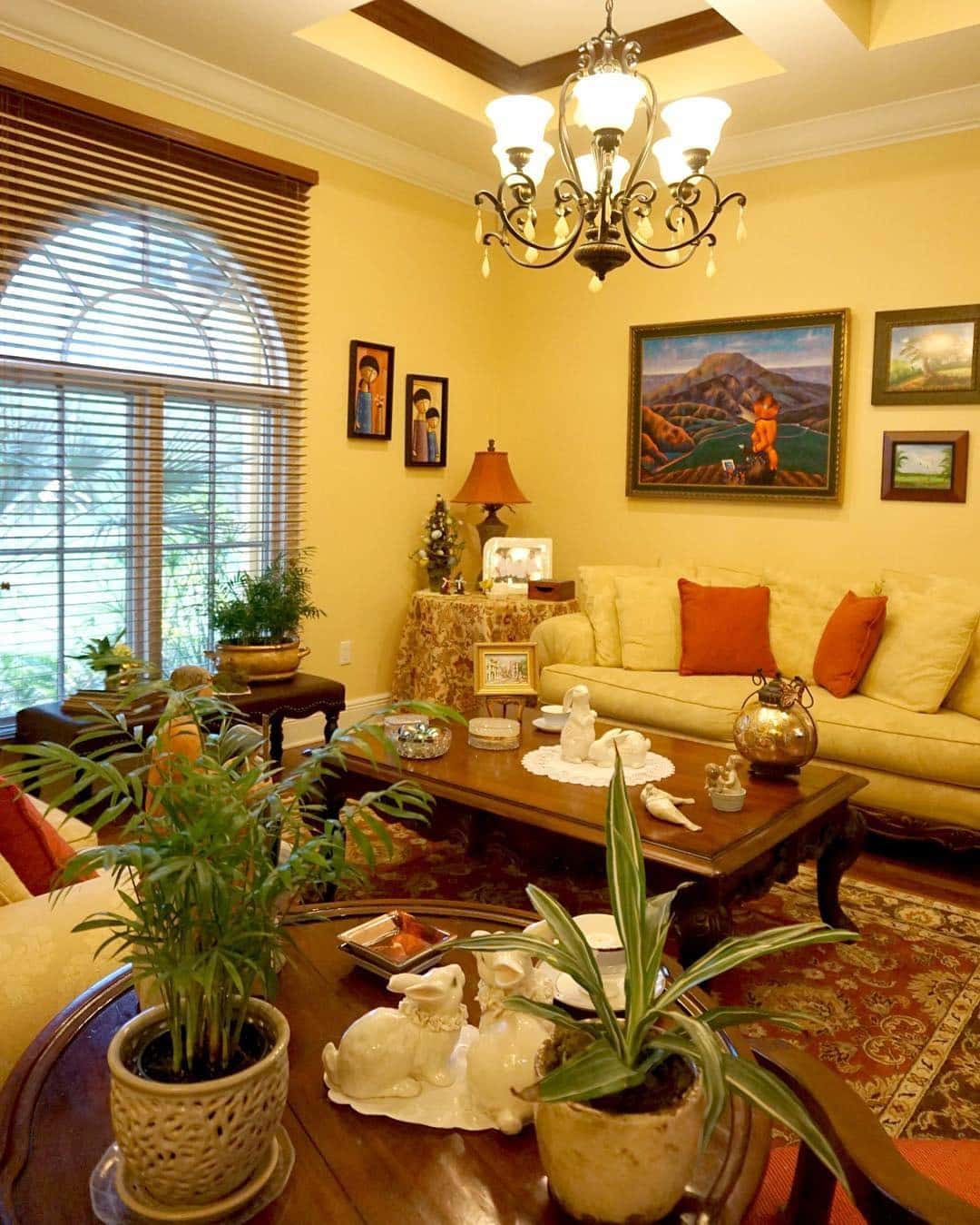 15. Traditional Yellow Living Room with Rich Wood Accents - yellow living room ideas