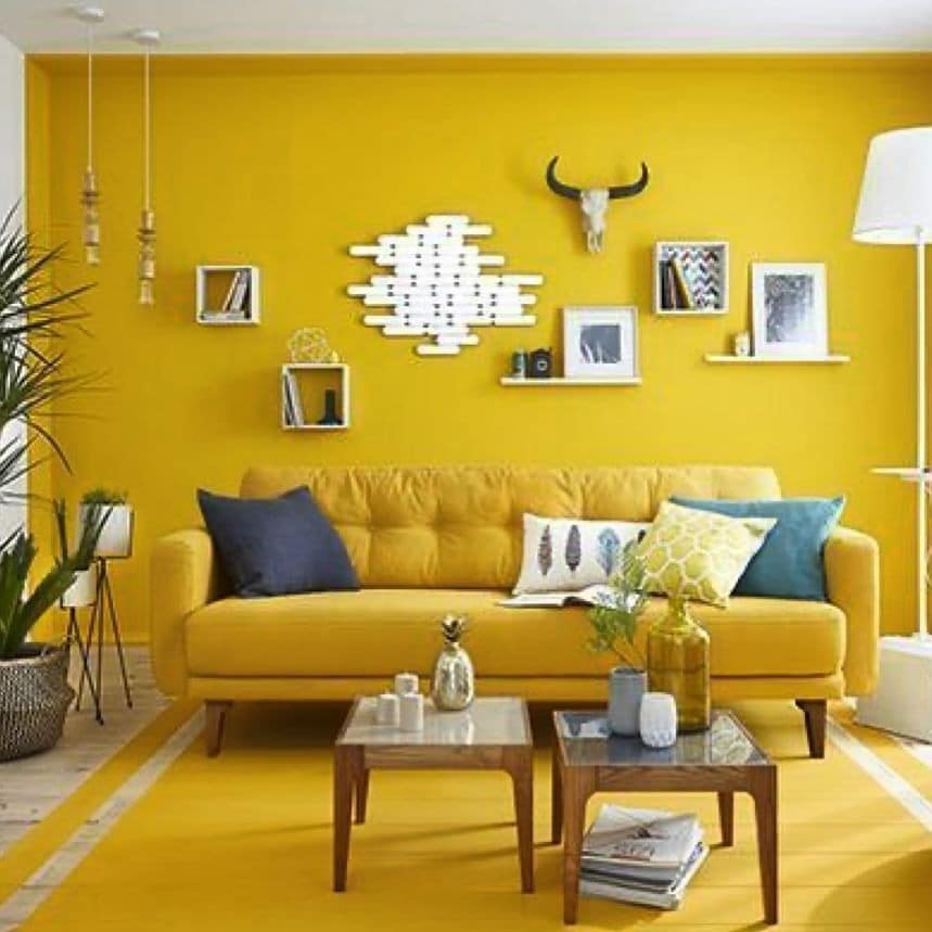 17. Bold Yellow Accent Wall with Modern Styling - yellow living room ideas