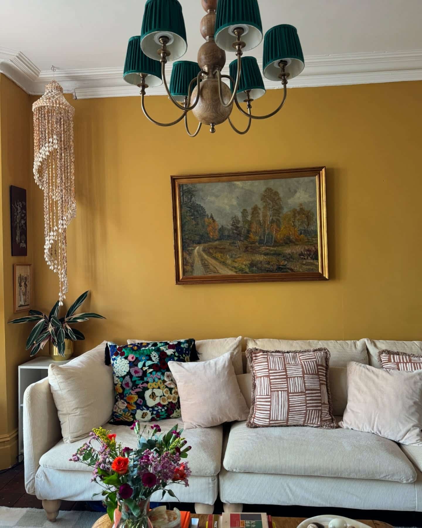 18. Mustard Yellow Walls with Eclectic Textile Layering - yellow living room ideas