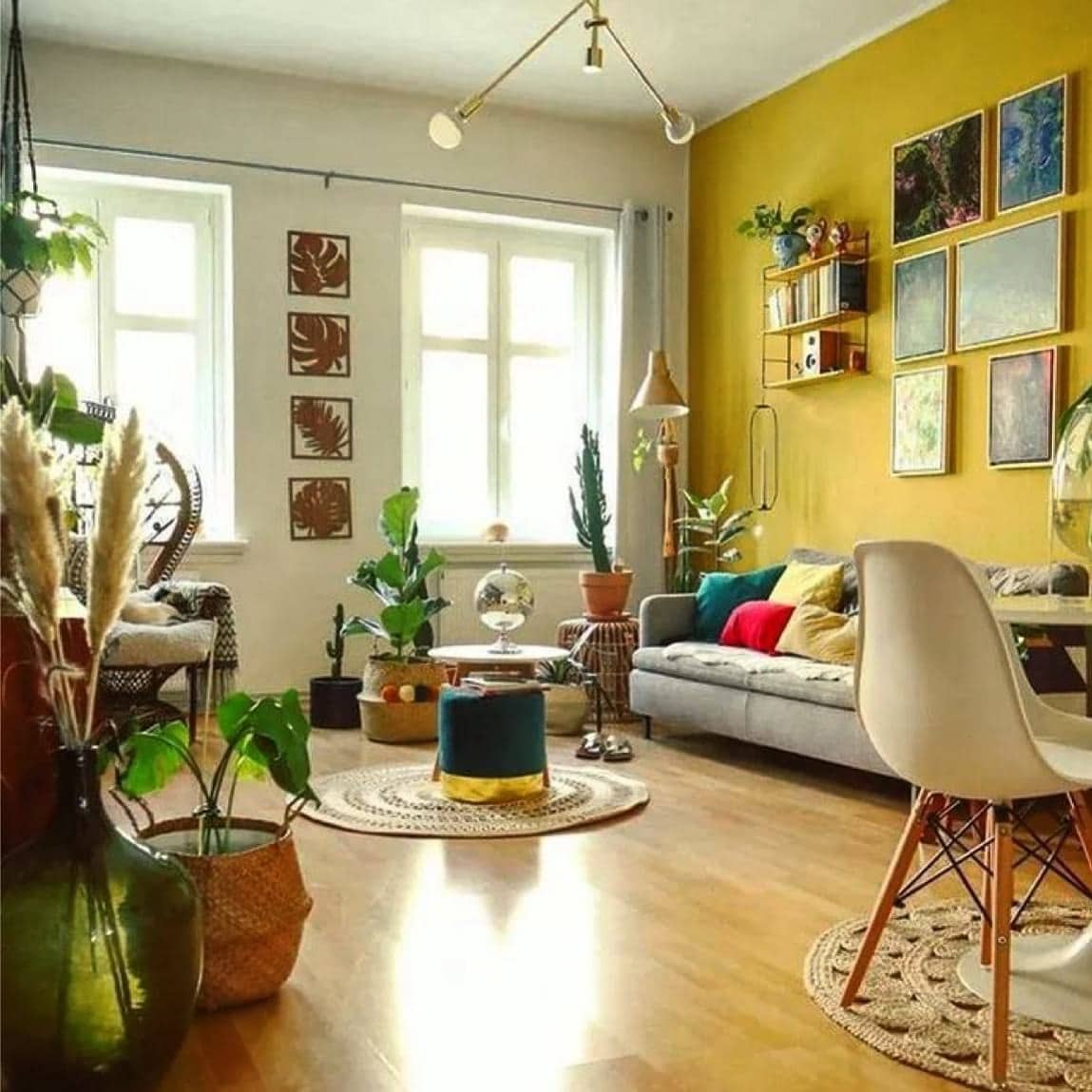 21. Mustard Yellow Accent Wall with Eclectic Plant Styling - yellow living room ideas