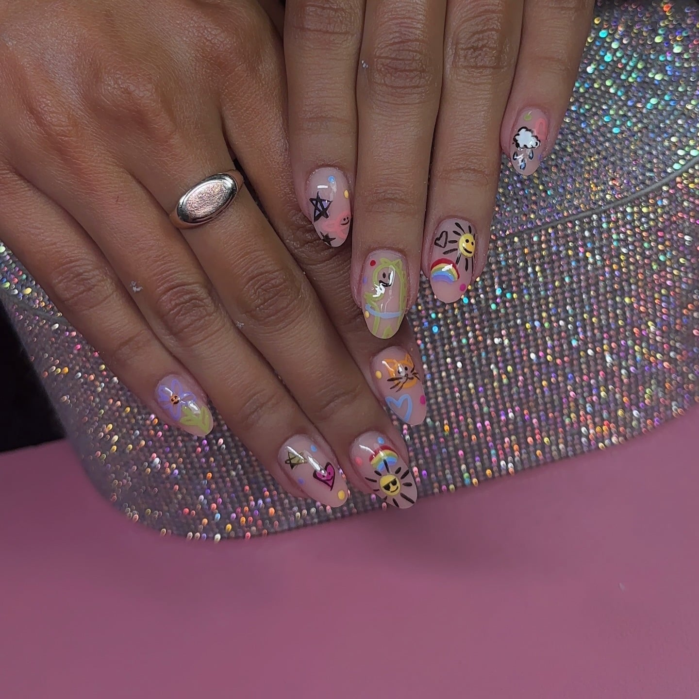 14. Whimsical Classroom Doodle Nails in Soft Pink and Multicolor - teacher nail ideas