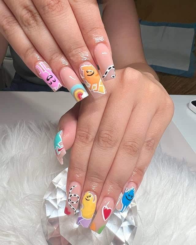 17. Long Acrylic Character Nails in Soft Nude with Bright Cartoon Art - teacher nail ideas