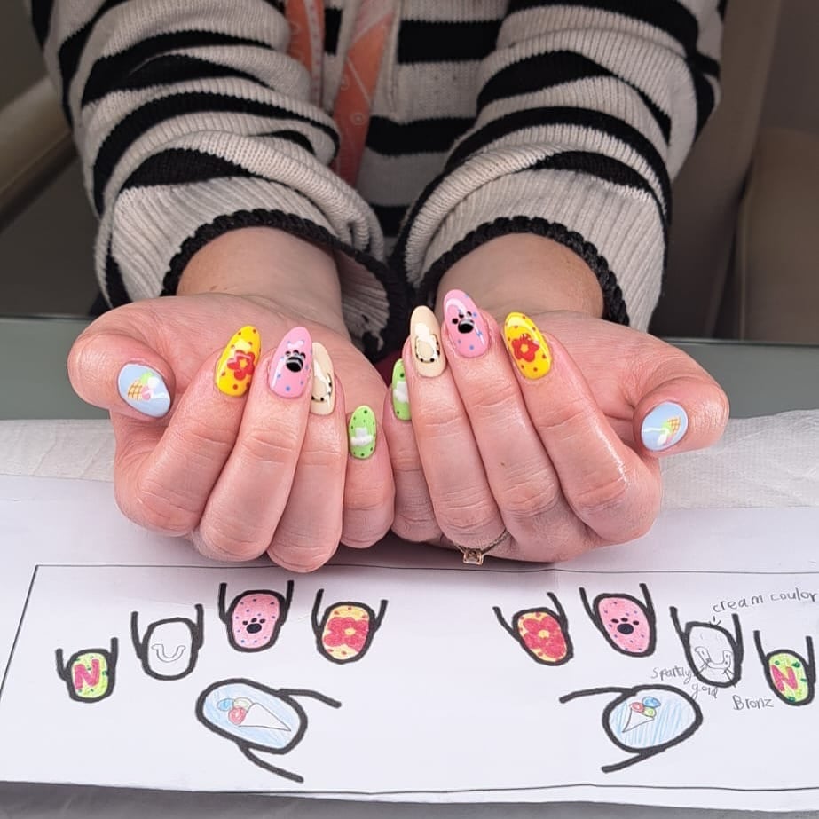19. Playful Classroom Character Nails in Pastel Yellow, Blue, and Pink - teacher nail ideas