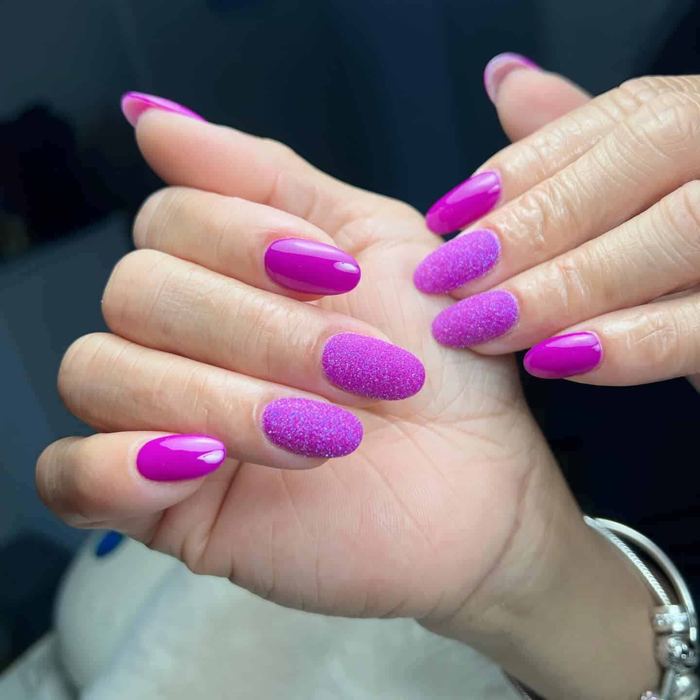 4. Bright Orchid Almond with Sugar Texture Accent - violet nail ideas