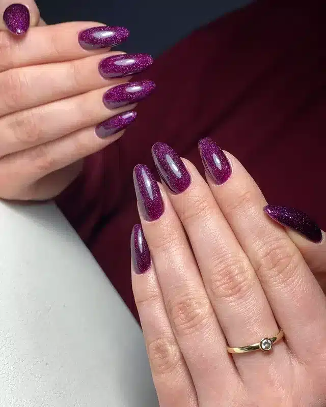 6. Magenta Cat Eye Almond Nails - violet nail ideas