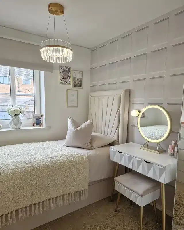 15. Elegant Panel Wall Bedroom in Soft Ivory and Gold Accents - small bedroom ideas