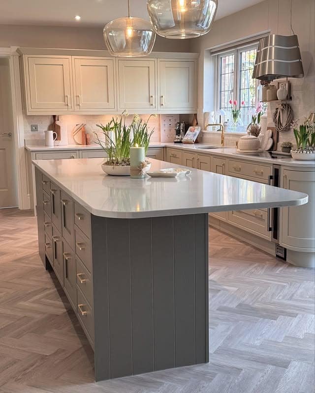 13. Soft Neutral Kitchen with Curved Island Design - beautiful kitchen ideas