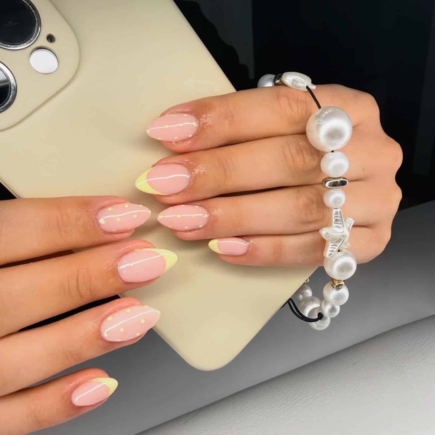 17. Almond Nails with Pastel Yellow French Tips and Dot Accents - nail ideas for short nails