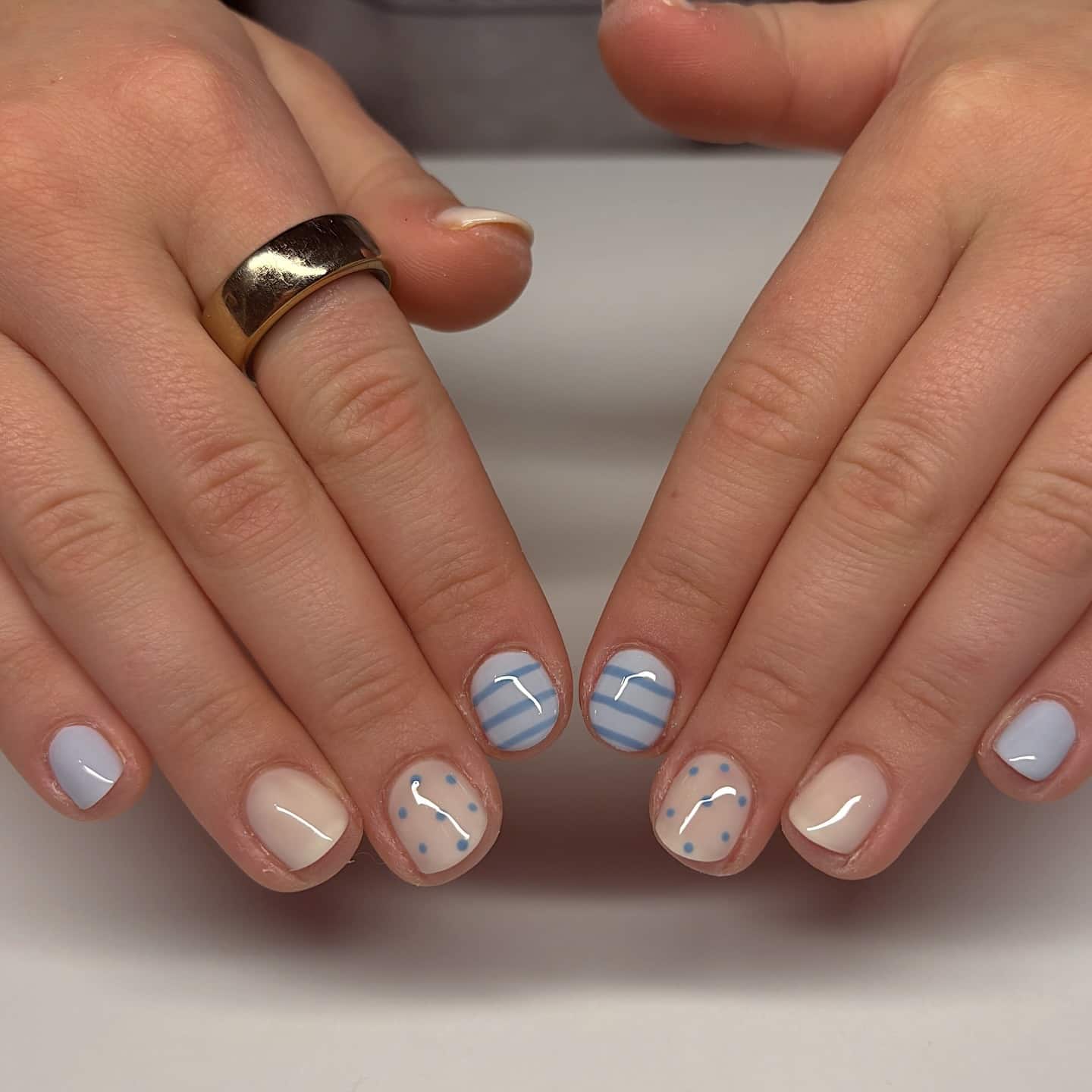 20. Short Round Nails in Baby Blue and Nude with Dot and Stripe Details - nail ideas for short nails