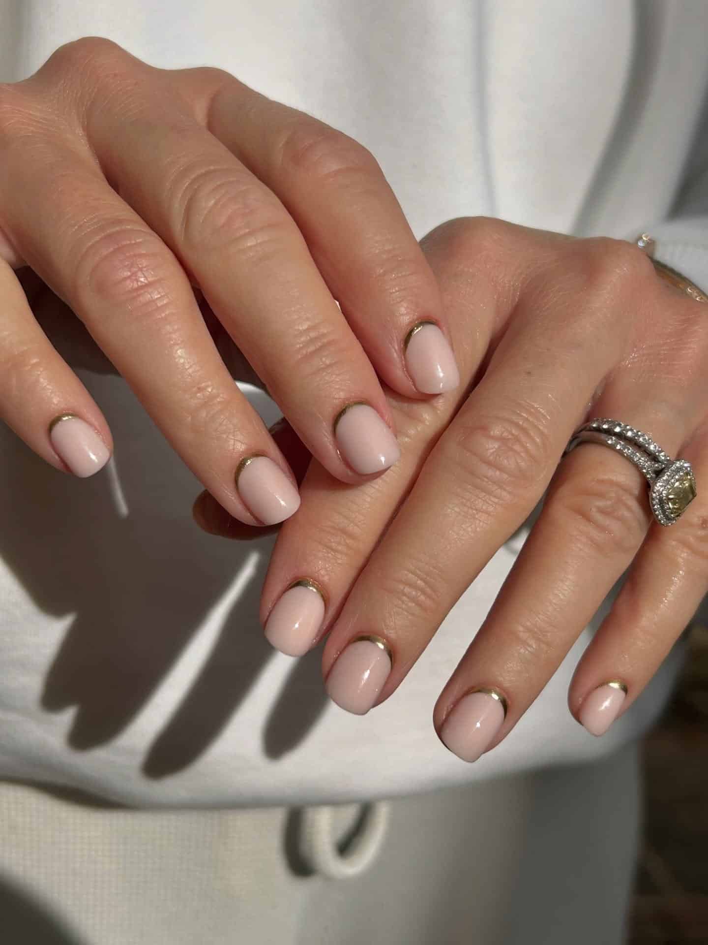 22. Short Rounded Nails in Soft Nude Pink with Gold Outline Detail - nail ideas for short nails