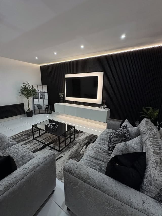 3. Black Slatted Feature Wall with Grey Lounge - grey and black living room ideas