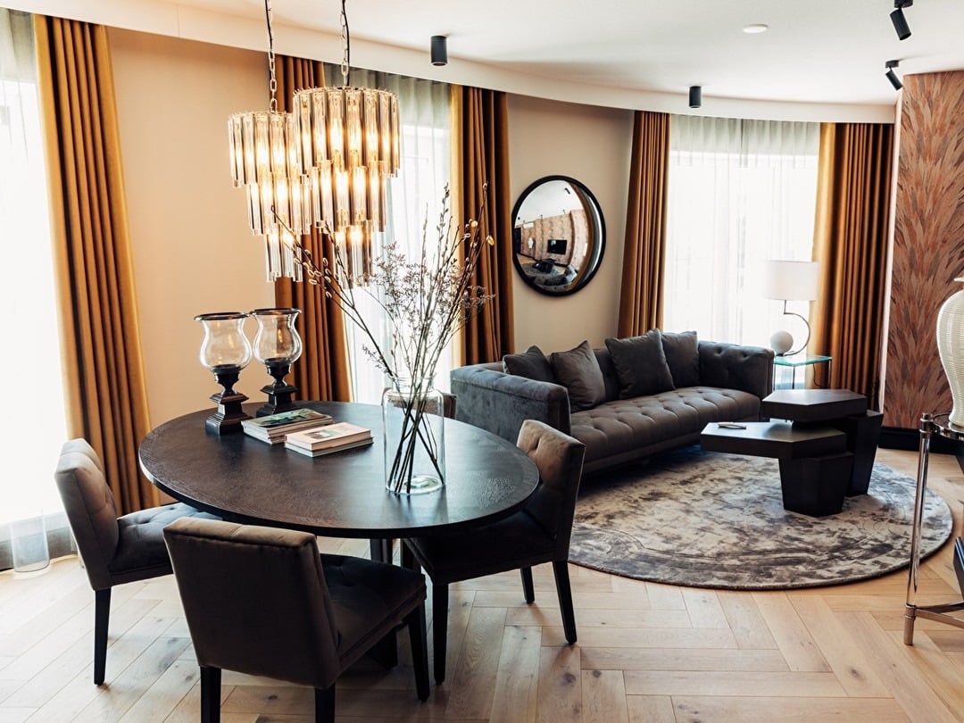 10. Elegant Grey Living with Black and Warm Metallic Touches - grey and black living room ideas