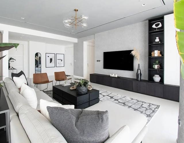 13. Bright Grey Living Room with Black Media Unit - grey and black living room ideas