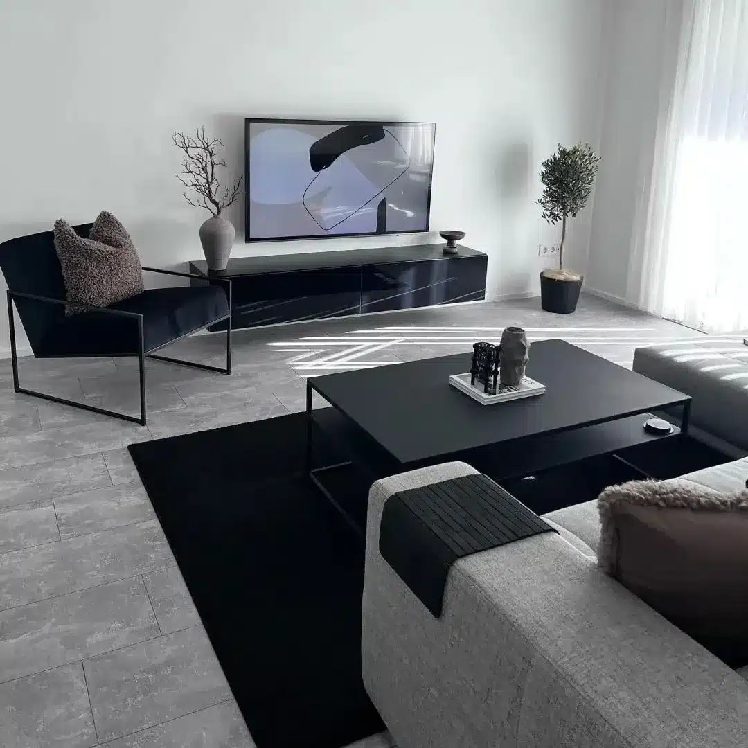 17. Minimal Grey Living Room with Black Statement Furniture - grey and black living room ideas