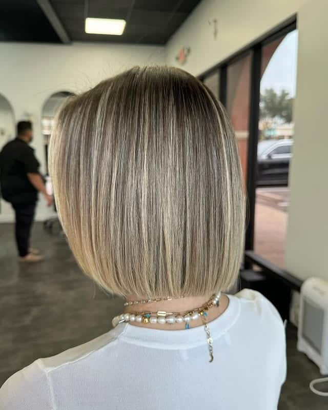6. Polished Blunt Bob with Cool Blonde Highlights - Short Blunt Cut