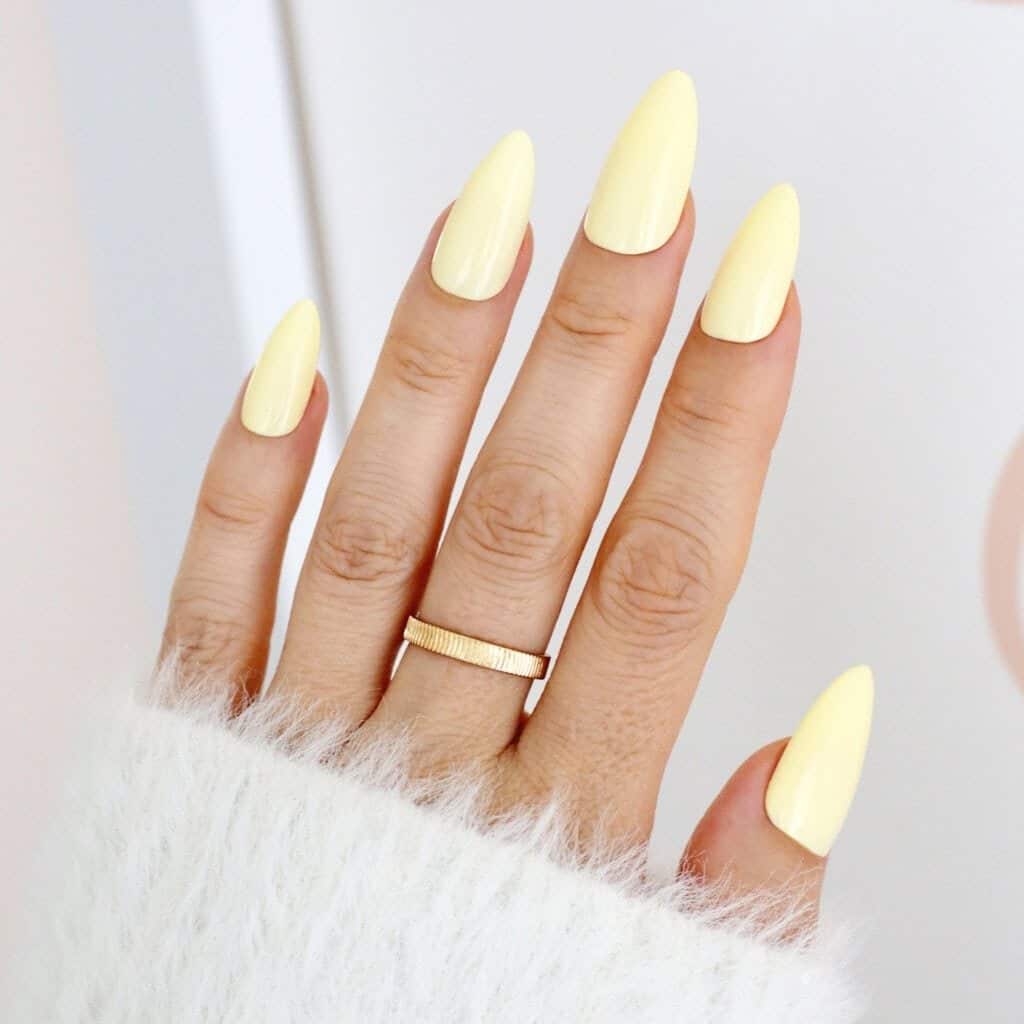 1. Soft Pastel Yellow Almond Gloss Nails - pastel yellow nail ideas