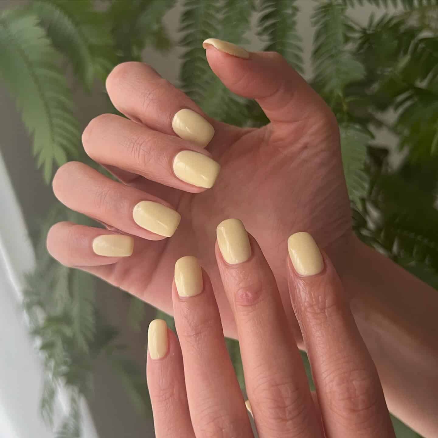 2. Short Square Butter Yellow Nails - pastel yellow nail ideas