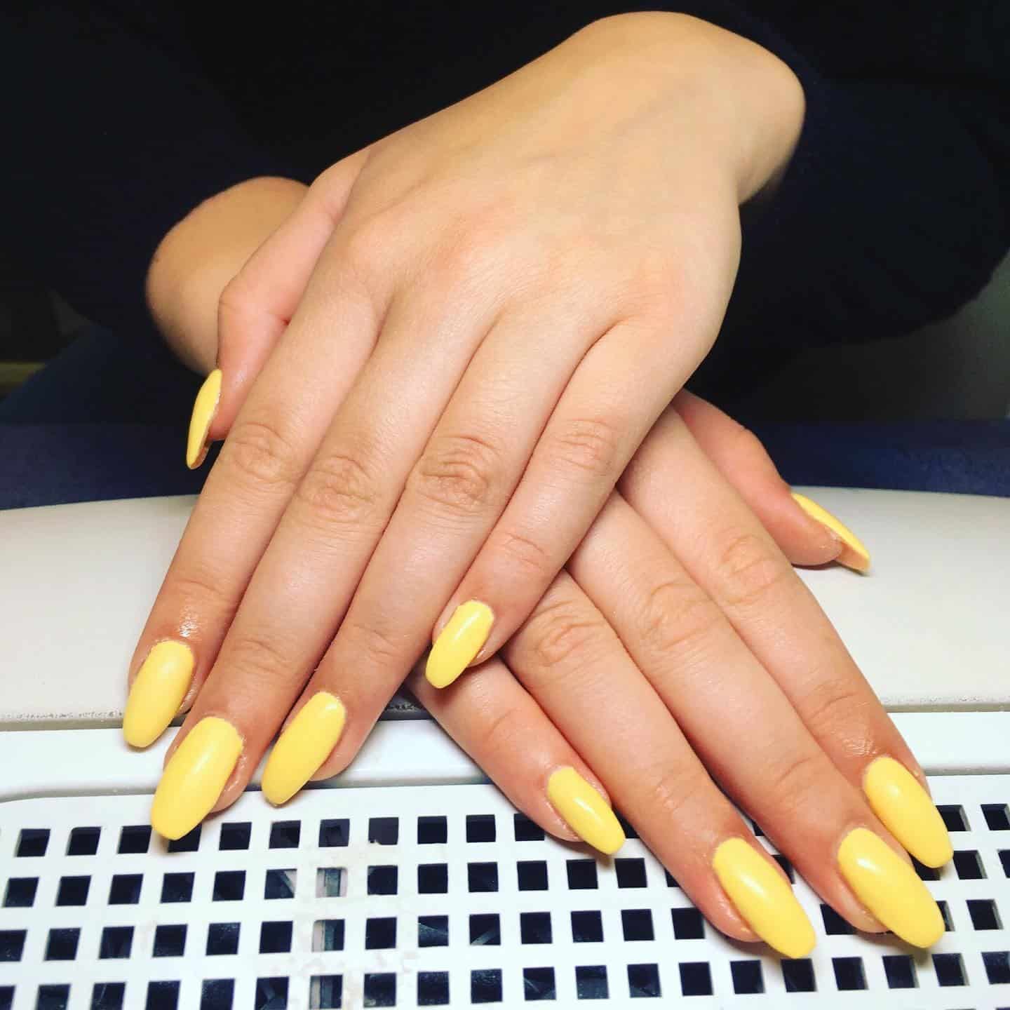 4. Bright Pastel Yellow Almond Salon Finish - pastel yellow nail ideas