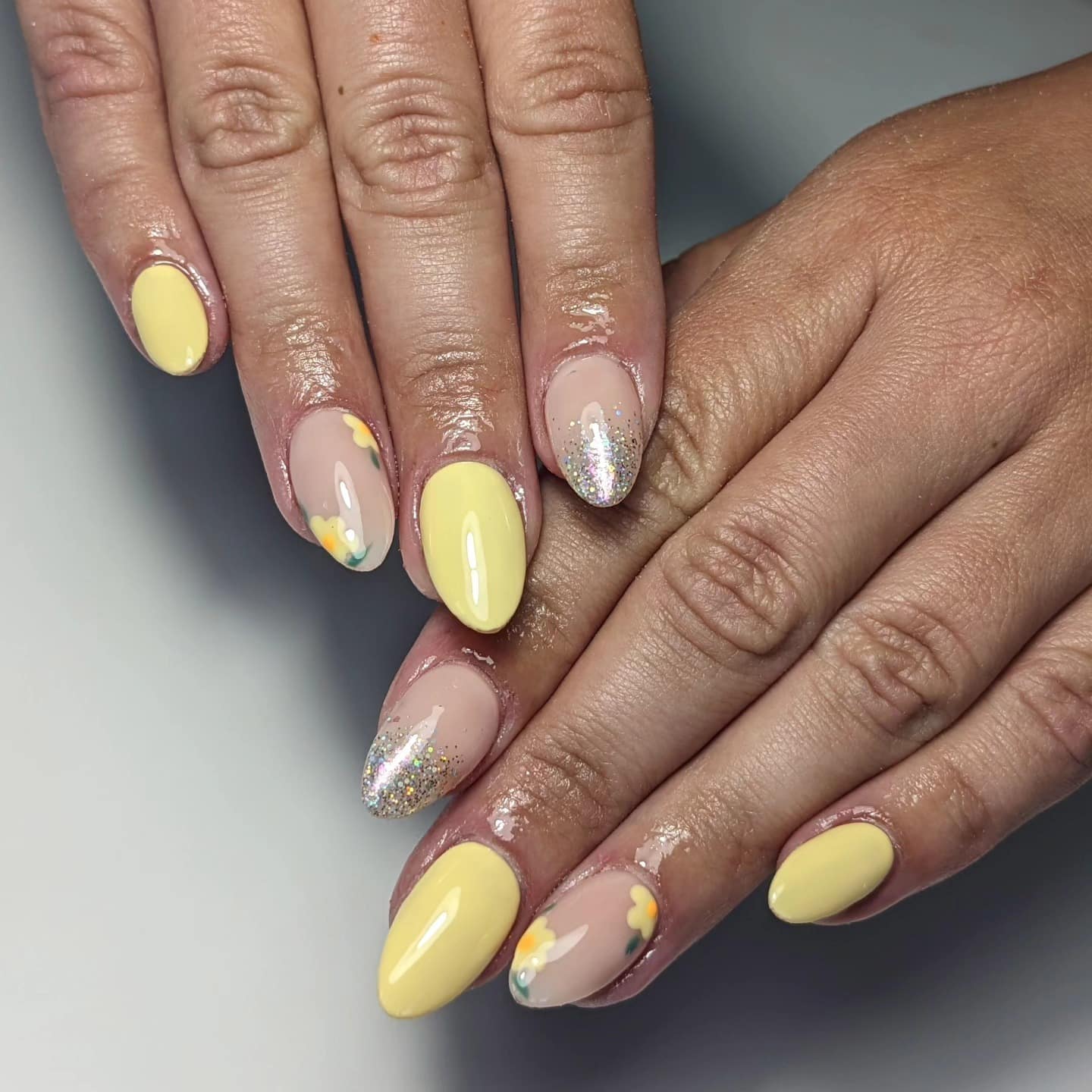 5. Pastel Yellow and Floral Accent Nails - pastel yellow nail ideas