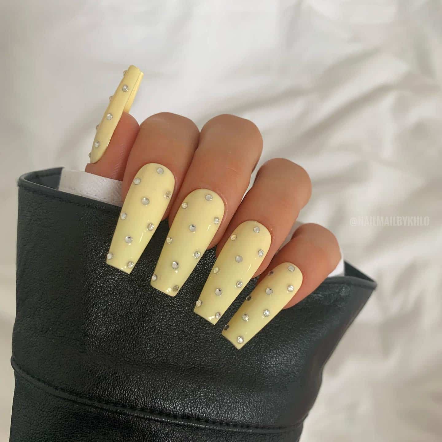 9. Pastel Yellow Rhinestone Coffin Nails - pastel yellow nail ideas