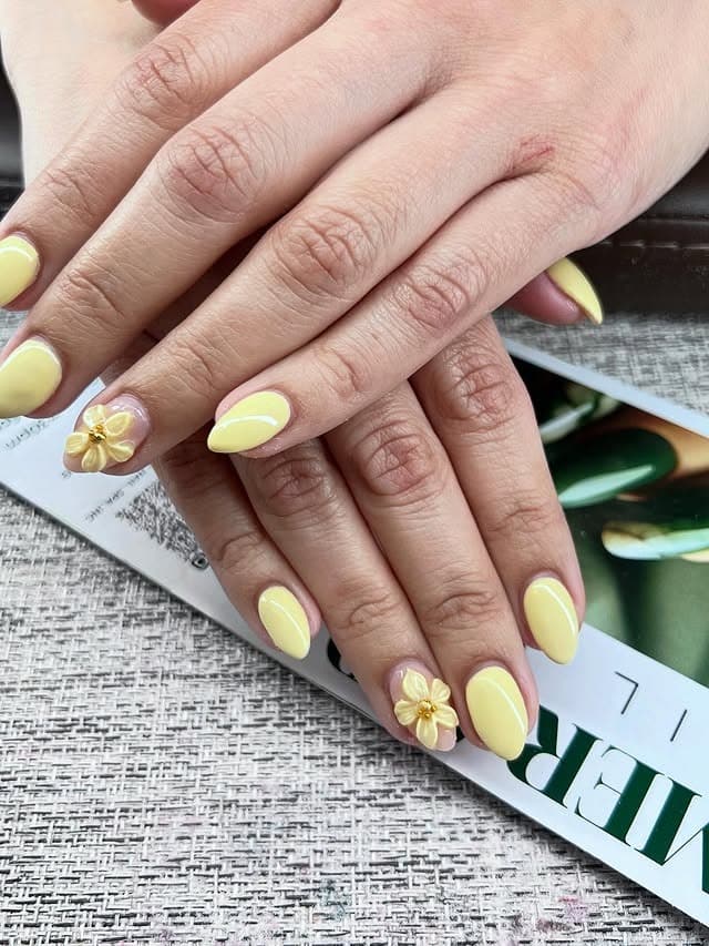 10. Pastel Yellow 3D Floral Accent Nails - pastel yellow nail ideas