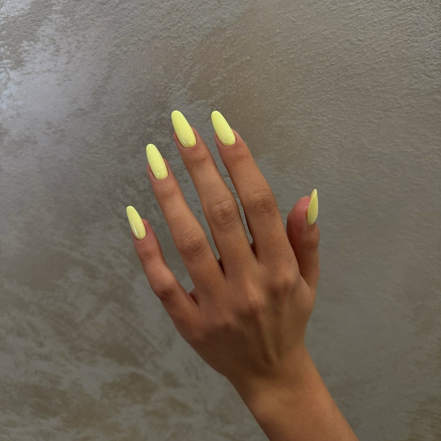 15. Long Almond Pastel Yellow Classic Gloss Nails - pastel yellow nail ideas