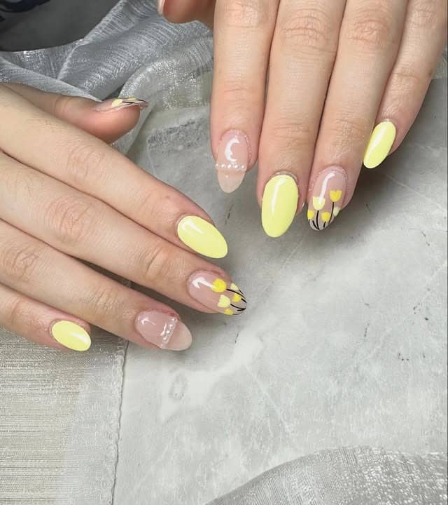 17. Pastel Yellow Minimal Floral Accent Almond Nails - pastel yellow nail ideas