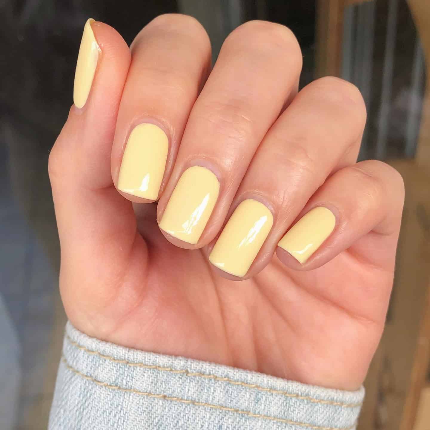 22. Short Square Creamy Pastel Yellow Gloss Nails - pastel yellow nail ideas