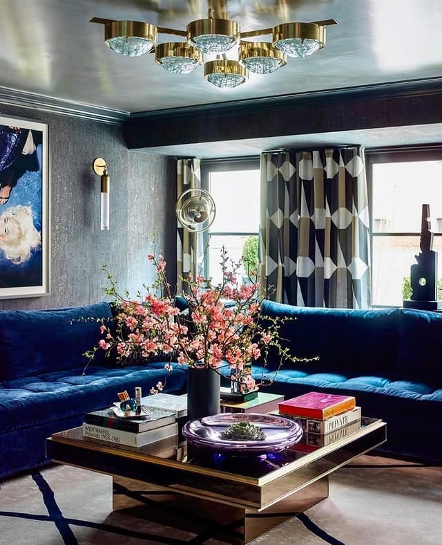 1. Glamorous Blue Velvet Sofa with Brass Accents - blue sofa living room ideas