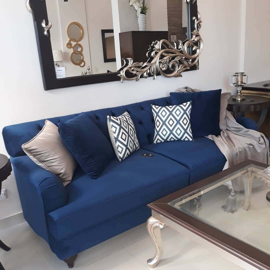 3. Classic Blue Sofa with Ornate Mirror Styling - blue sofa living room ideas