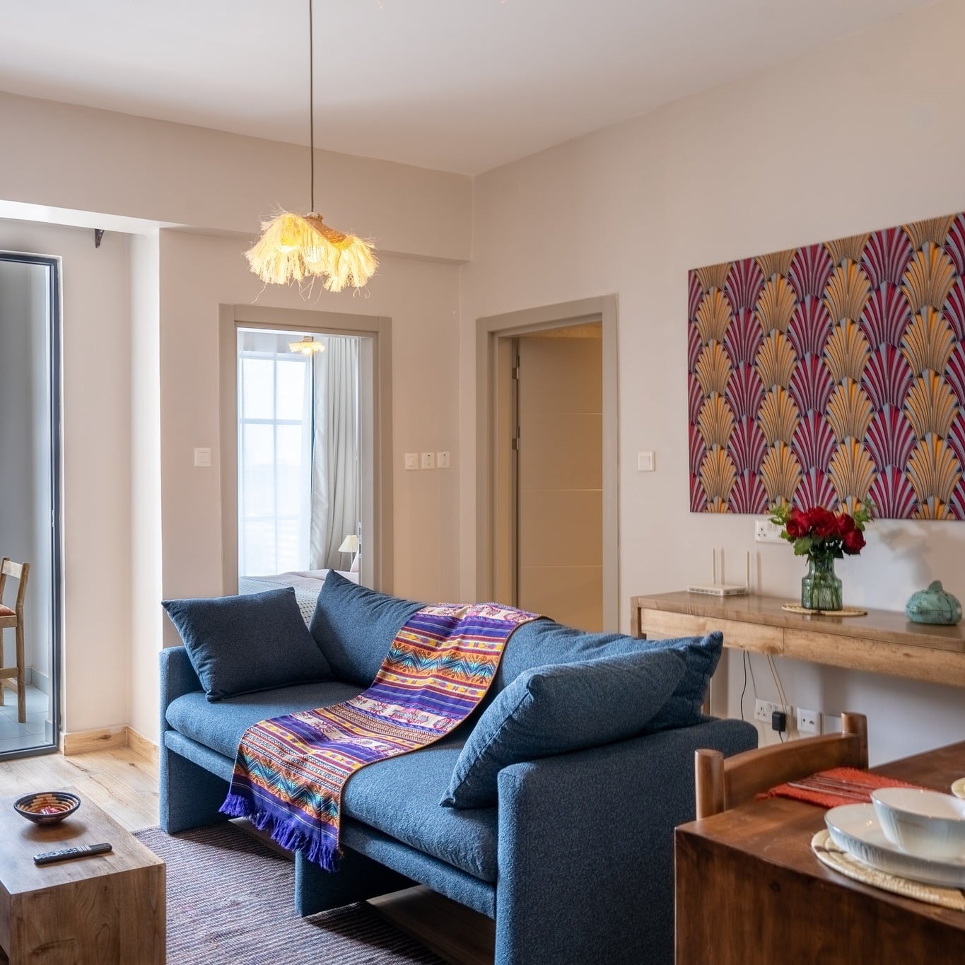 4. Contemporary Blue Sofa with Colorful Textile Accent - blue sofa living room ideas