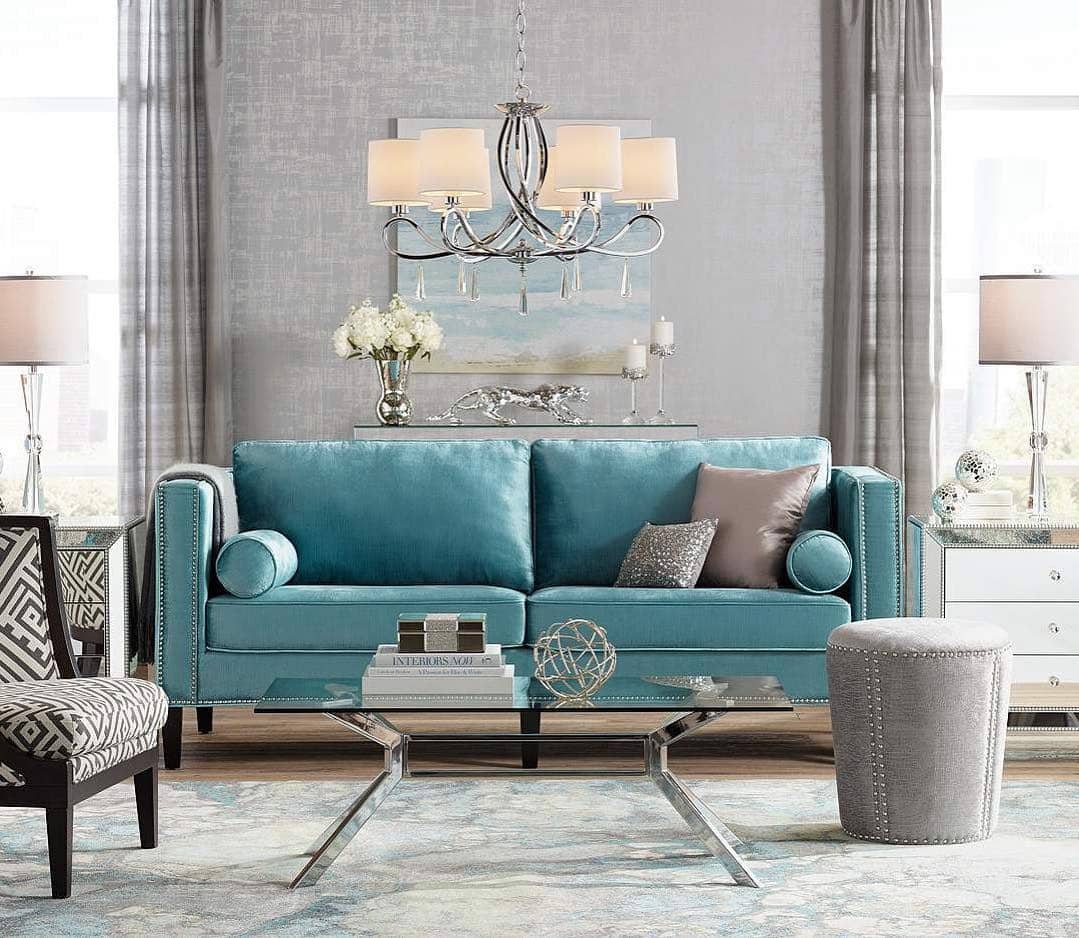 7. Elegant Teal-Blue Sofa with Symmetrical Styling - blue sofa living room ideas