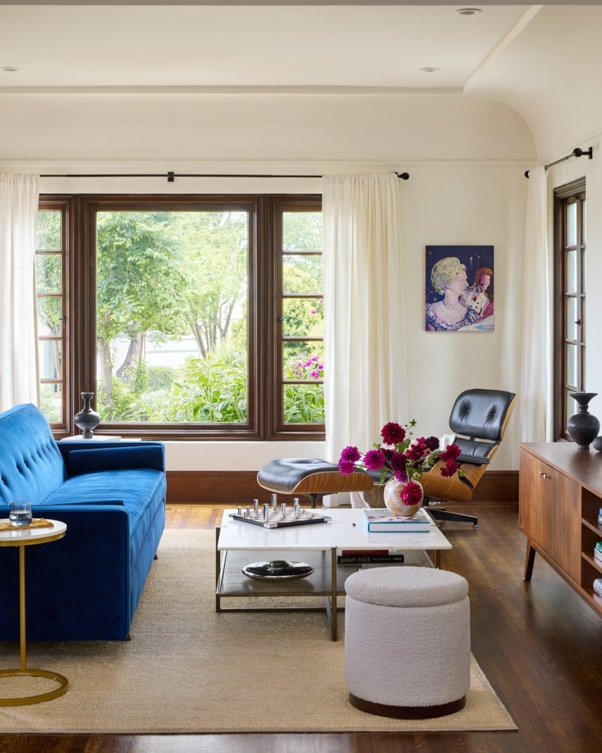 10. Bright Blue Sofa with Natural Wood and Garden Views - blue sofa living room ideas
