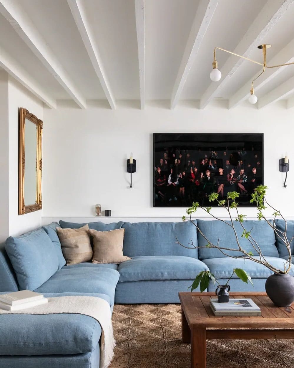 12. Soft Blue Sectional with Rustic Wood and White Beams - blue sofa living room ideas