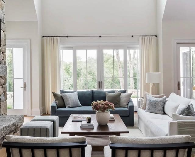 14. Classic Blue Sofa with Symmetrical Neutral Seating - blue sofa living room ideas