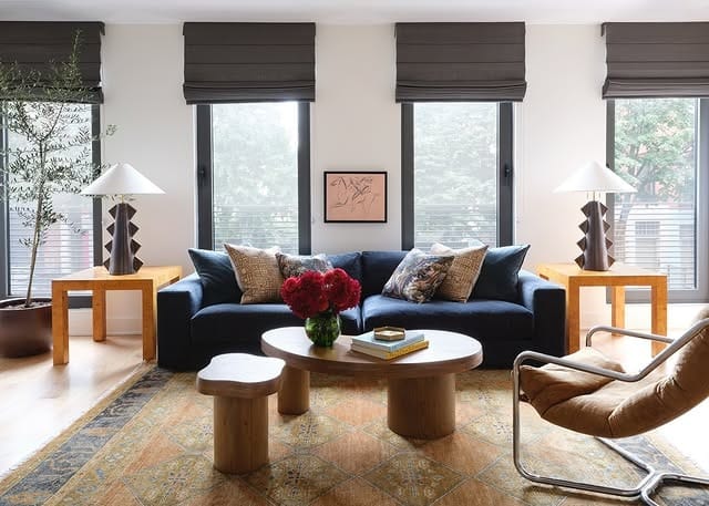 16. Dark Blue Sofa with Mid-Century Wood Accents - blue sofa living room ideas