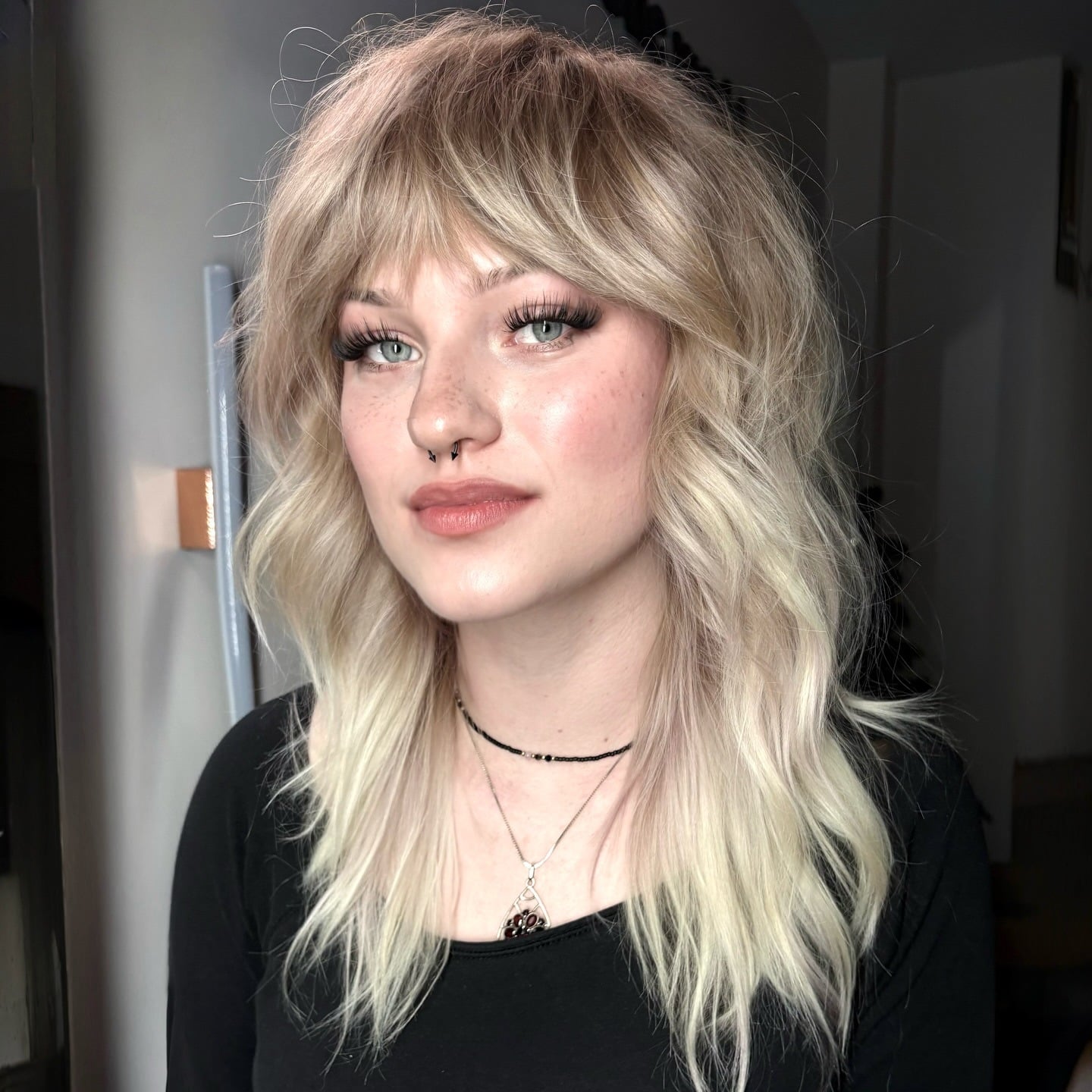 3. Shaggy Wolf Cut with Wispy Bangs in Cool Blonde - Wolf Haircuts With Bangs