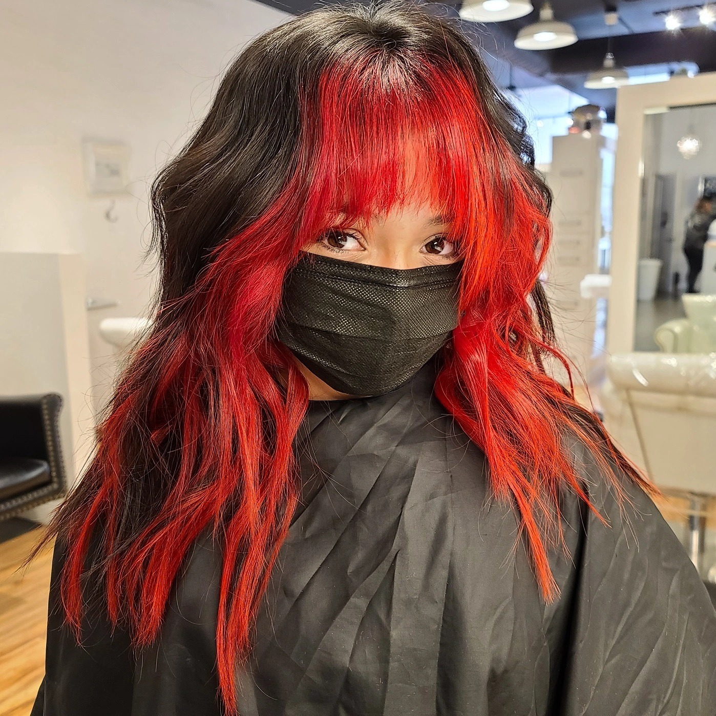 8. Edgy Wolf Cut with Choppy Bangs in Black and Red Contrast - Wolf Haircuts With Bangs