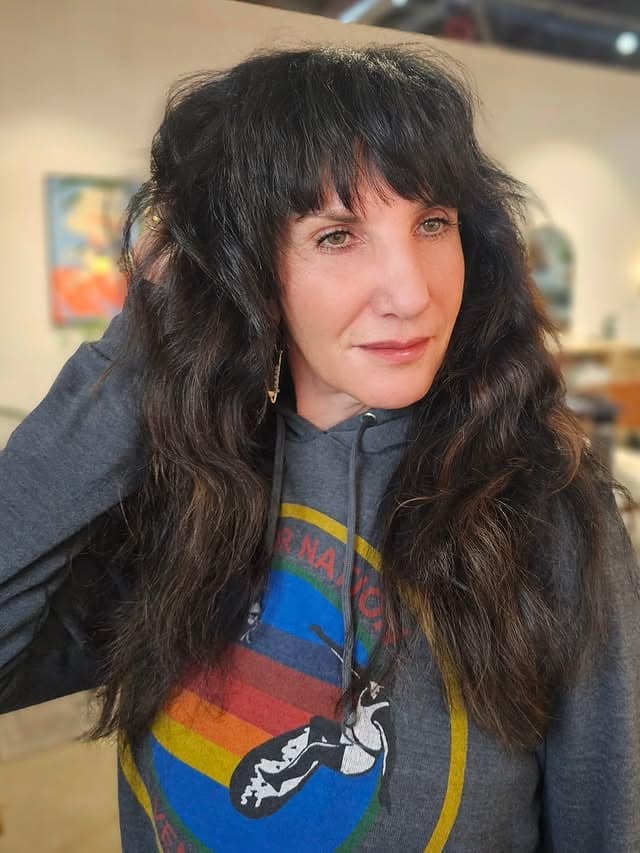 14. Voluminous Long Wolf Cut with Full Bangs in Soft Black - Wolf Haircuts With Bangs