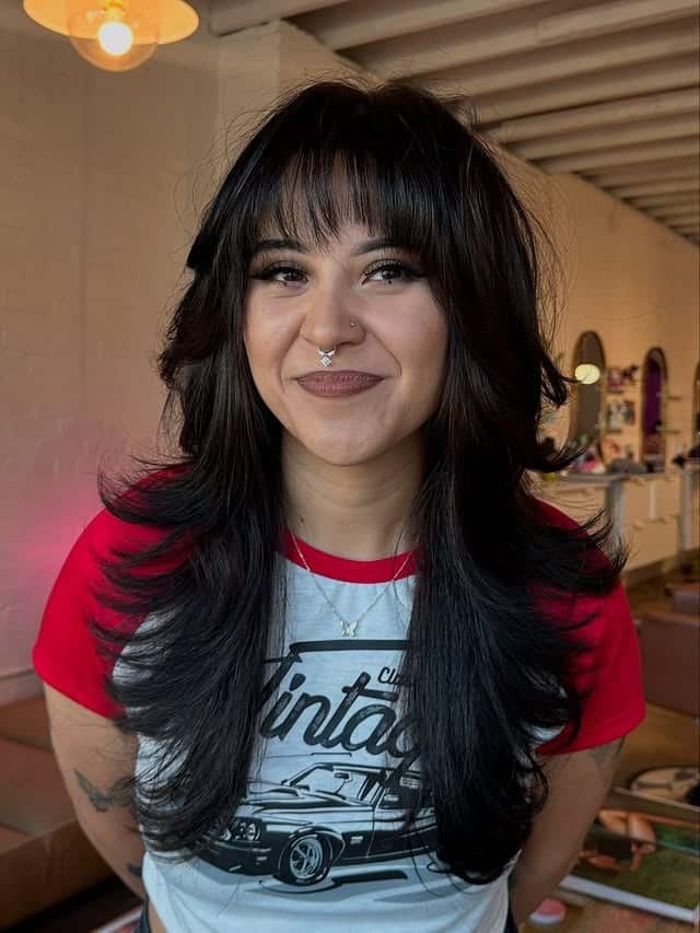 22. Voluminous Layered Wolf Cut with Full Fringe in Deep Black - Wolf Haircuts With Bangs