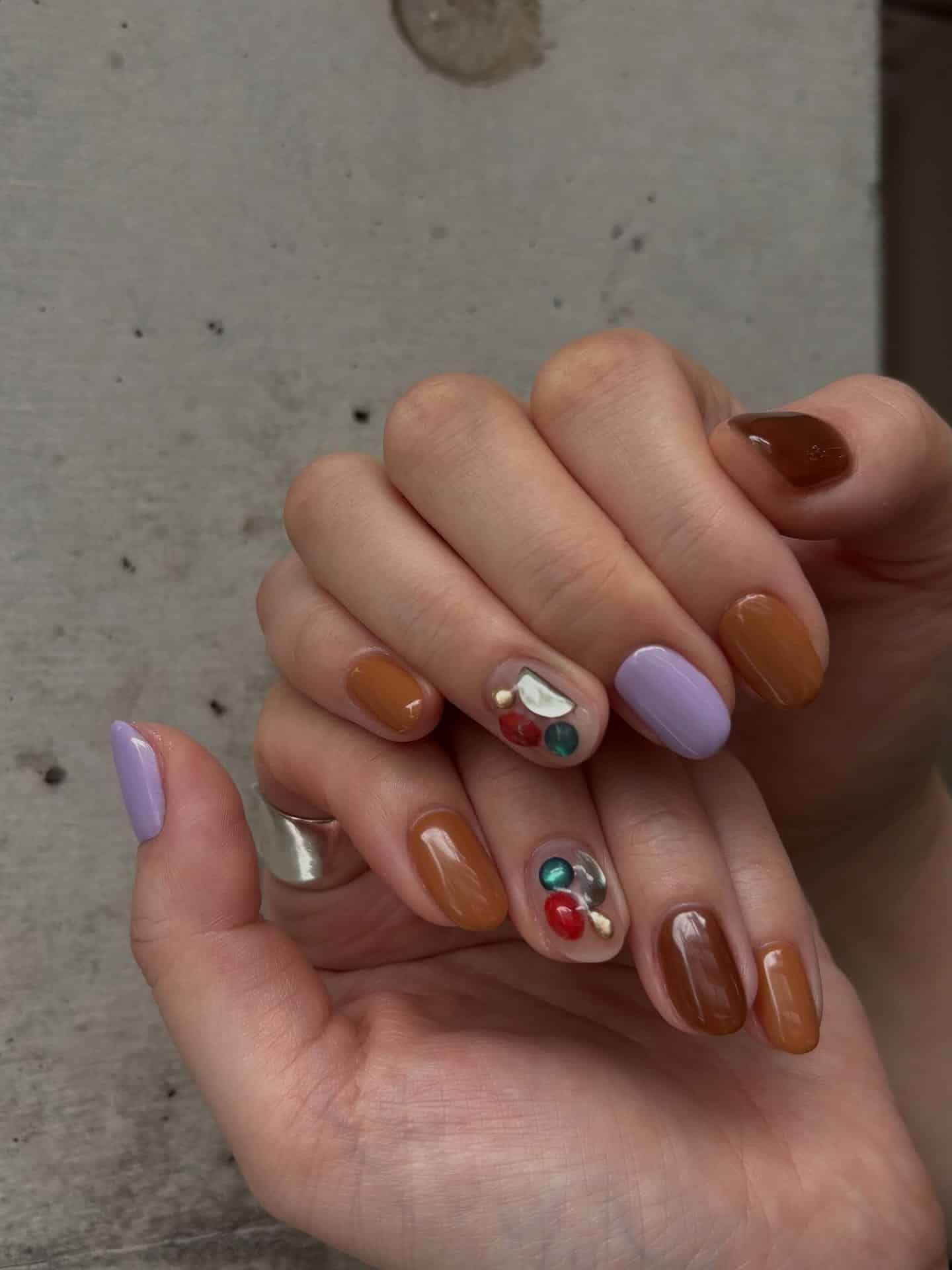 3. Earthy Brown and Lavender Accent Nails - very short nail ideas