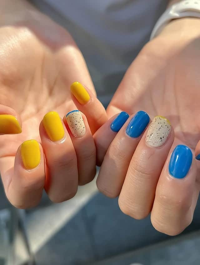 6. Bright Yellow and Blue Color Block Nails - very short nail ideas